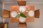 foto ambientada da mesa de jantar extensivel euro nozes vista de cima com loucas sobre o tampo fechado e 4 cadeiras euro